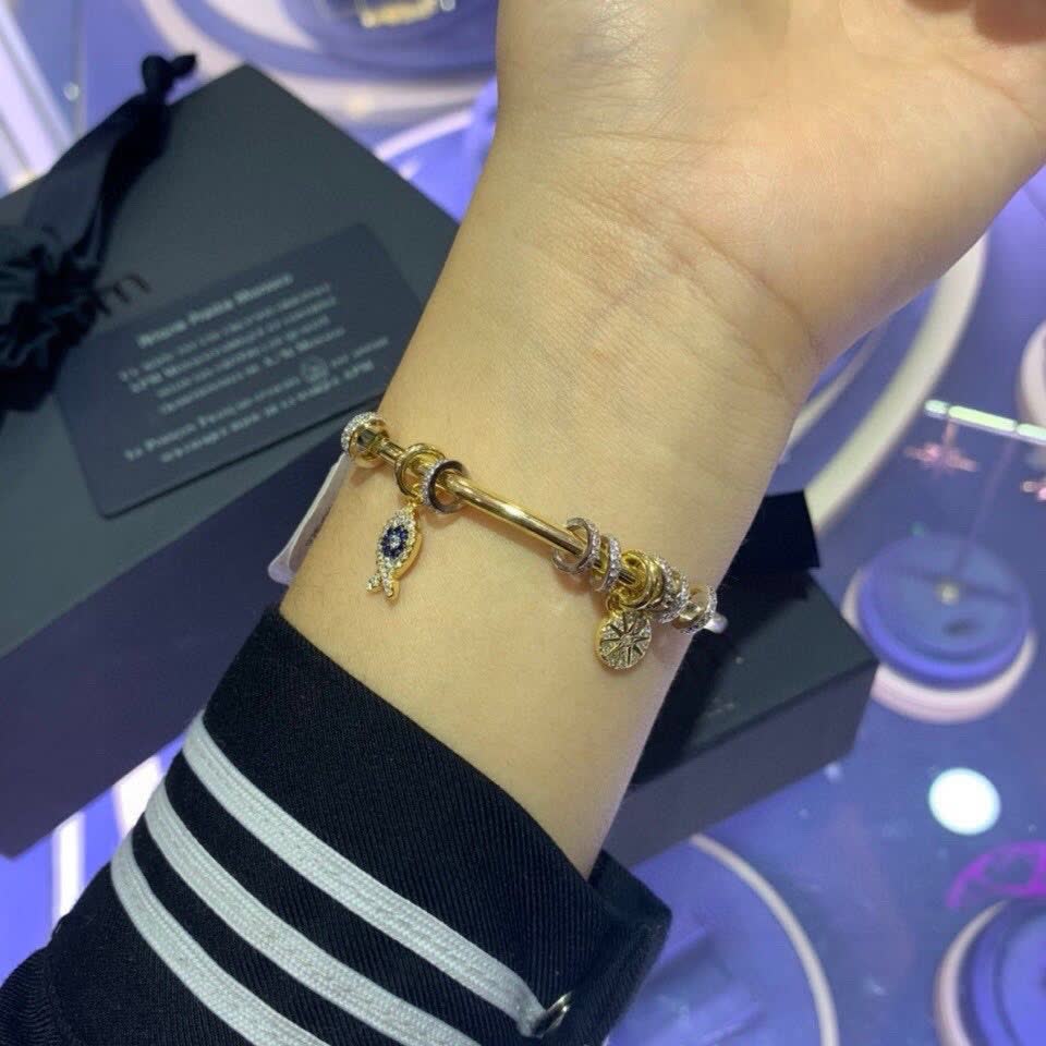 APM Monaco Gold Tone Bracelet with Fish and Star Charms